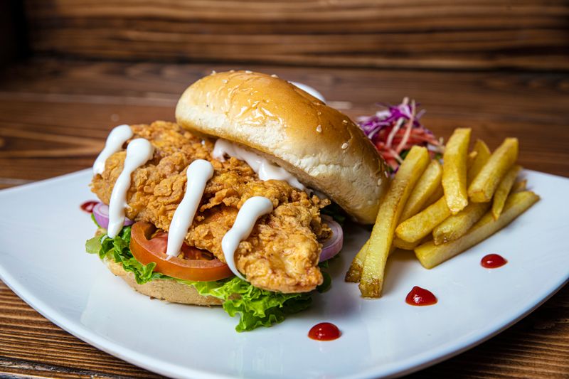 The Wing Sandwich - wings over signature burger