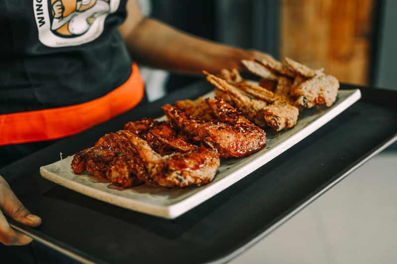 behind the scenes at Wings over kitchen team preparing orders